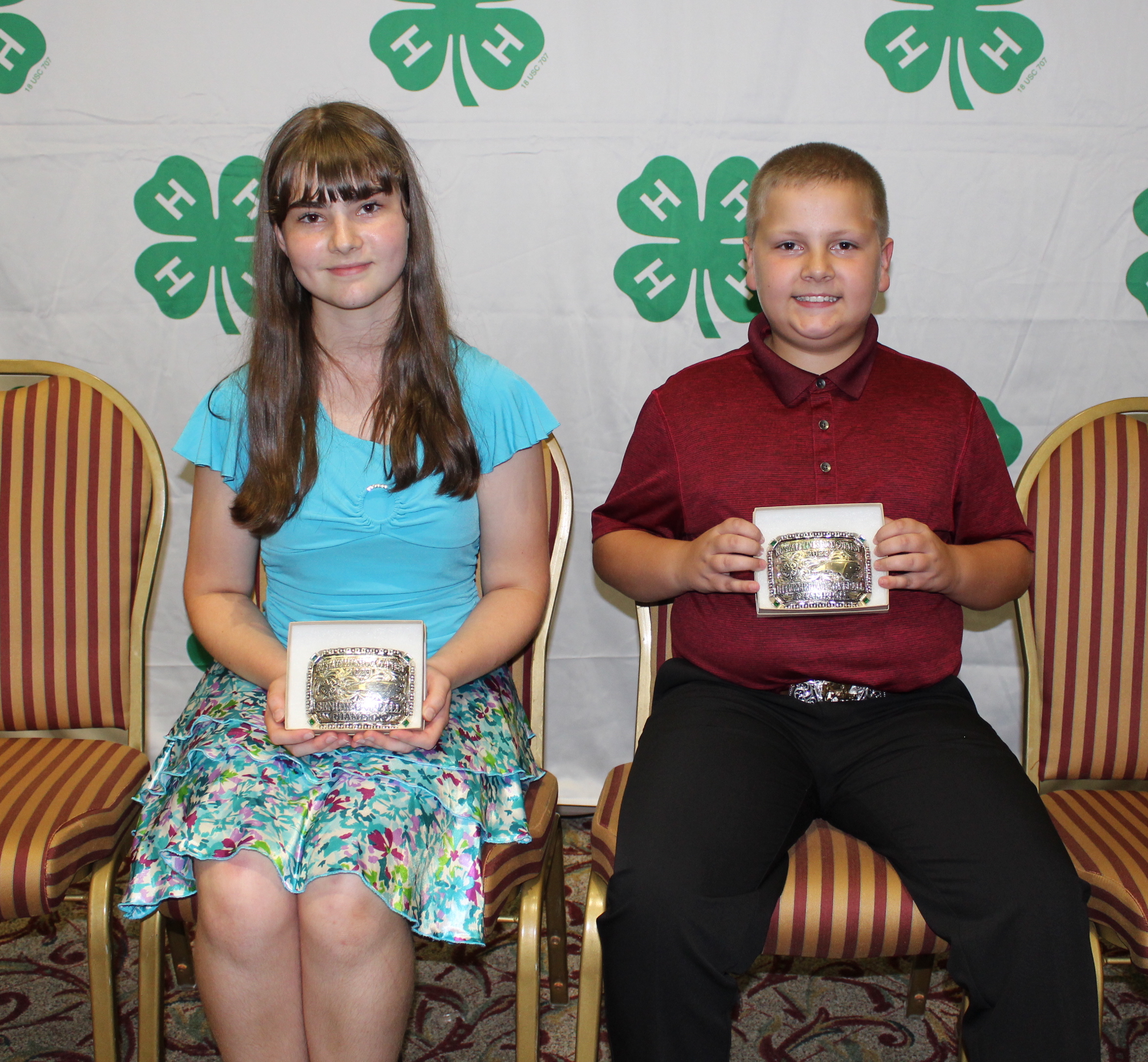 Two 4-H Winners pose with Belt Buckles